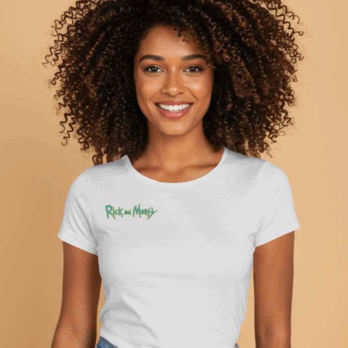 A smiling woman wearing a white fitted crop t-shirt with the green "Rick and Morty" logo printed on the left chest. The background is a warm tan color.