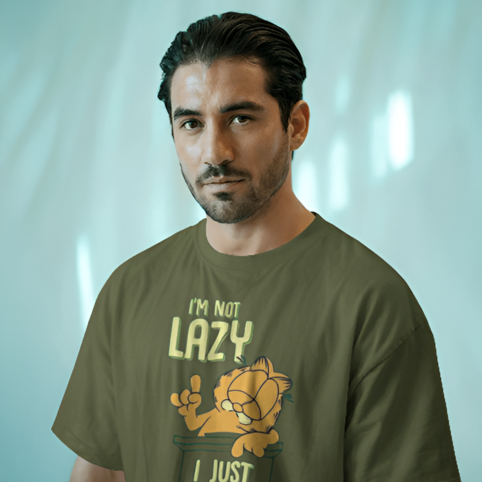 Man wearing an olive green T-shirt with a cartoon graphic and the text "Chill Mode ..."